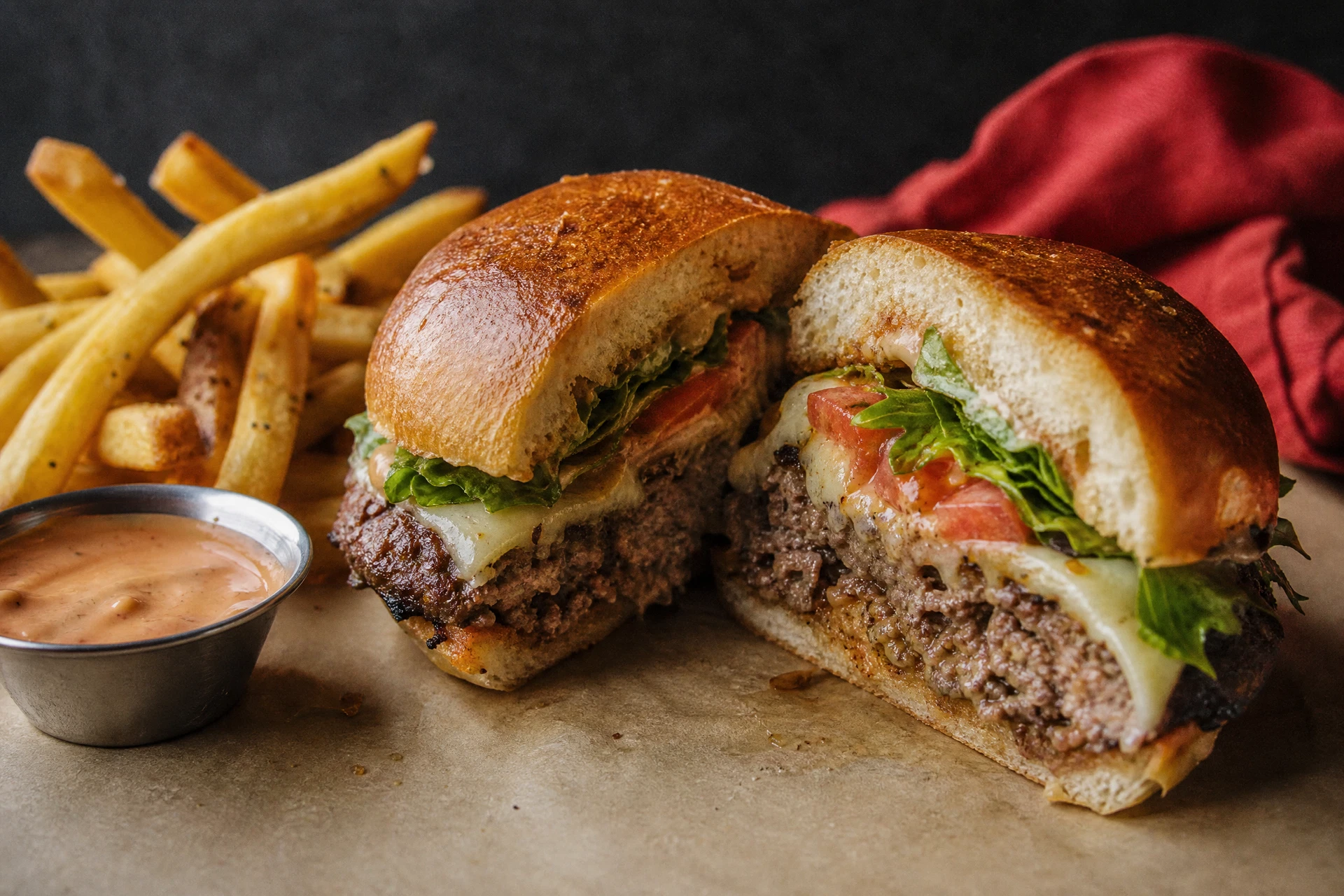 Charbroiled burger and fries close-up